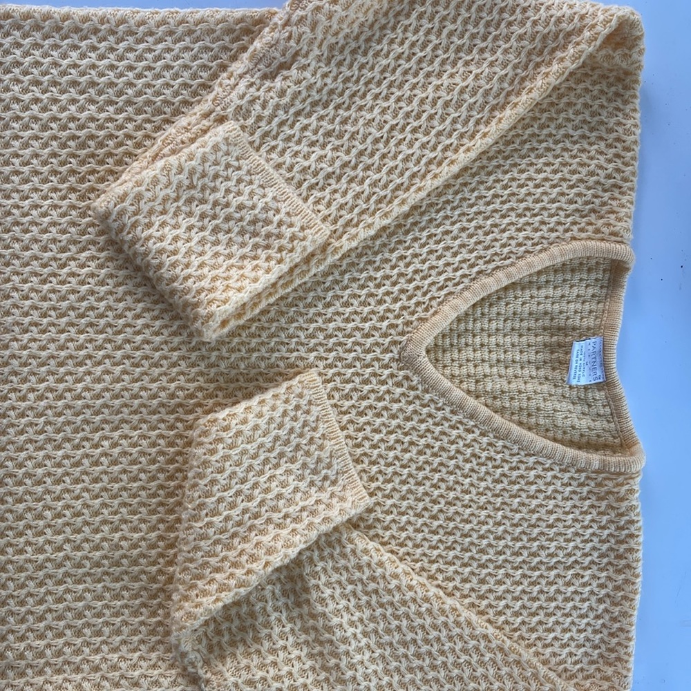 A buttery warm knit sweater, clean and well taken care of wore very lightly.
